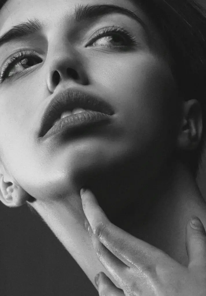 Stunning close-up of a young woman expressing elegance and beauty.